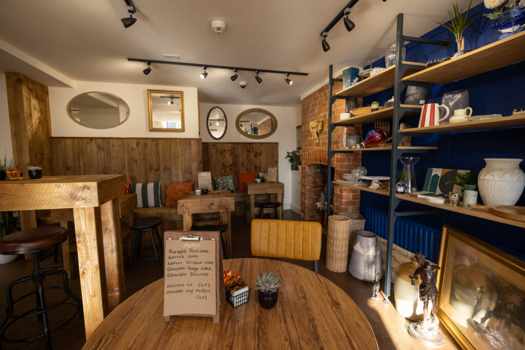 An interior shot - cafe tables and shop rails